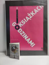 Zdjęcie przedstawia książkę i plakat