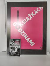 Zdjęcie przedstawia książkę i plakat