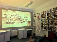 Zdjęcie przedstawiające ludzi w bibliotece